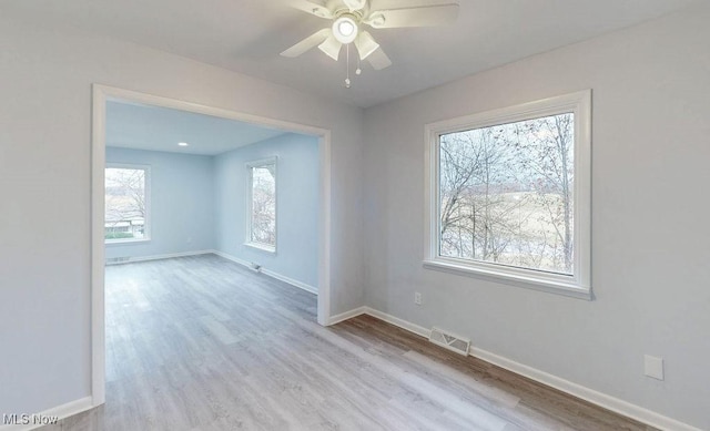 unfurnished room featuring light hardwood / wood-style flooring and ceiling fan