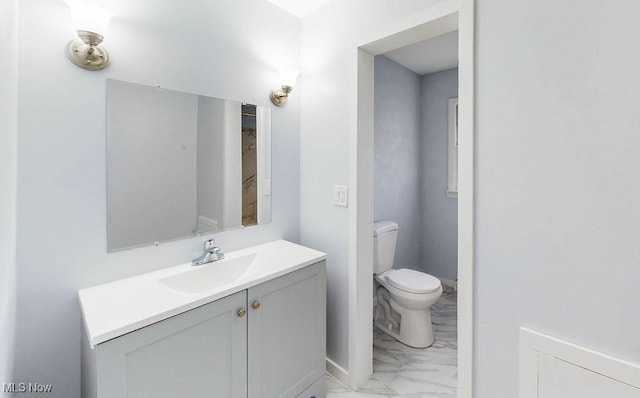 bathroom with vanity and toilet