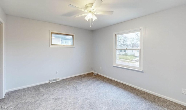 unfurnished room featuring carpet flooring and ceiling fan