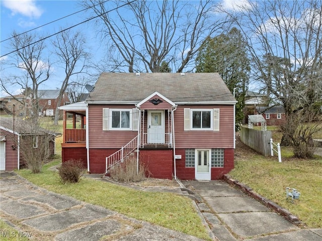 bungalow-style house featuring a front yard