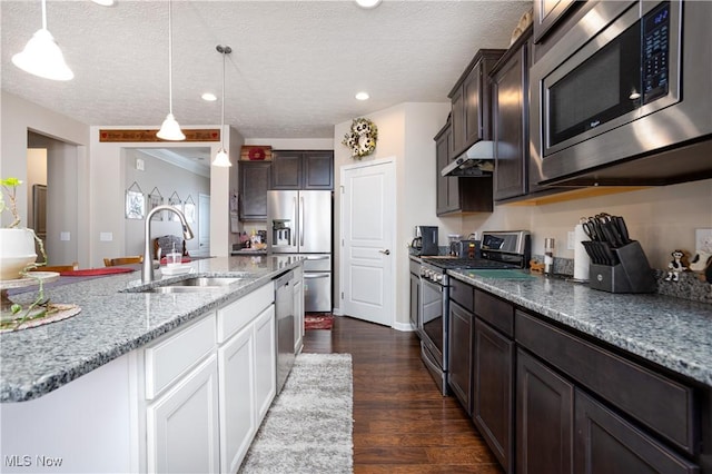 kitchen featuring dark wood-type flooring, white cabinets, sink, a textured ceiling, and stainless steel appliances