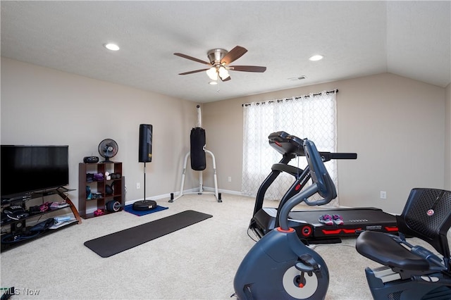 workout area with carpet, a textured ceiling, vaulted ceiling, and ceiling fan