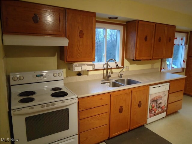 kitchen featuring white appliances and sink