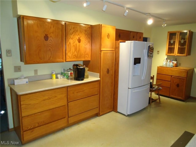 kitchen with white fridge with ice dispenser