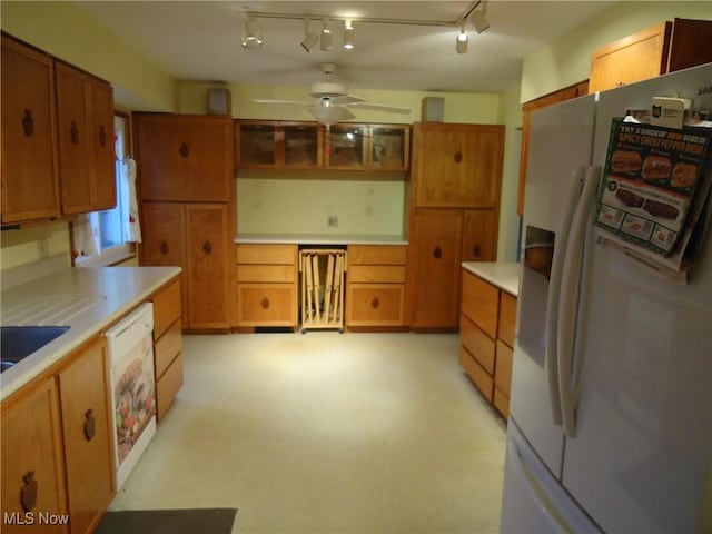 kitchen featuring ceiling fan and white fridge with ice dispenser