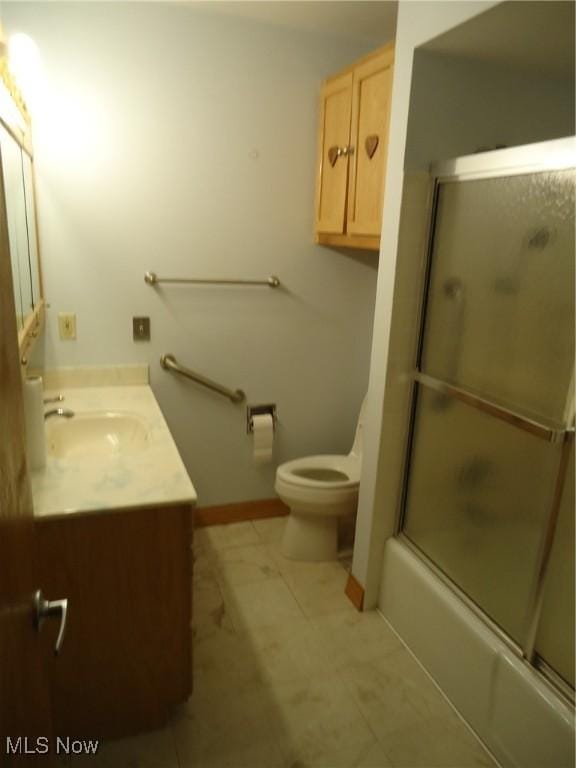 full bathroom with toilet, vanity, and combined bath / shower with glass door