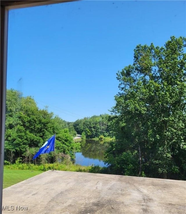 view of patio / terrace with a water view