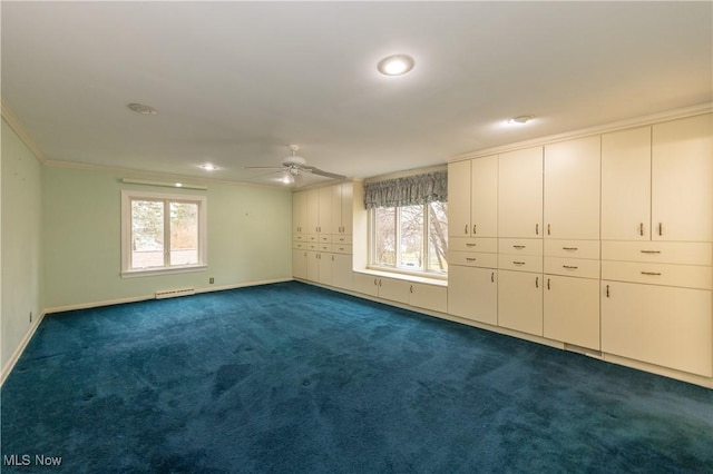 unfurnished bedroom with multiple windows, crown molding, ceiling fan, and dark carpet