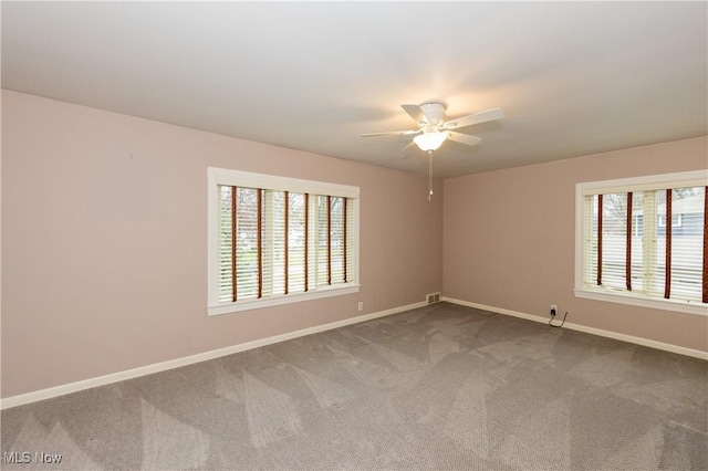 carpeted empty room with ceiling fan