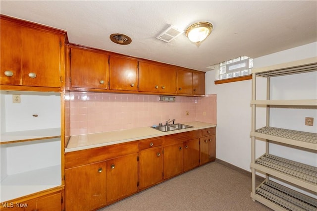 kitchen with tasteful backsplash and sink