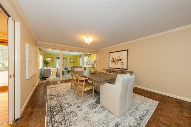 dining area with dark parquet flooring and ornamental molding