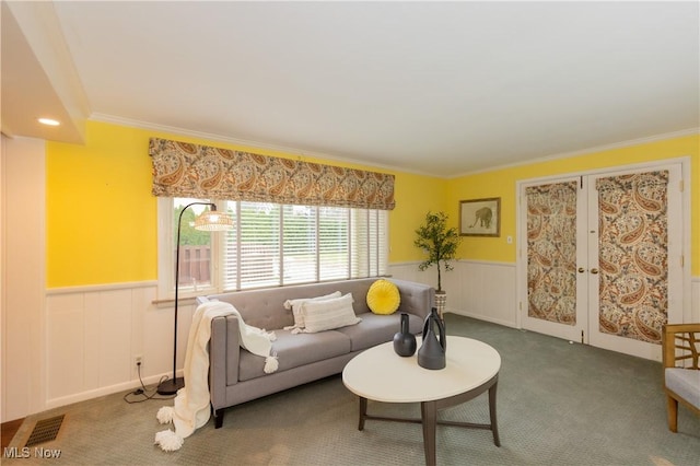 living room featuring carpet floors and crown molding