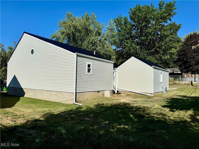 view of property exterior featuring a lawn