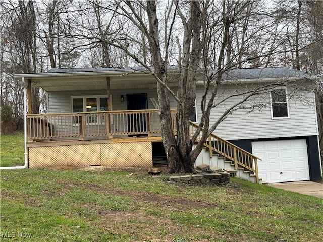 view of front of property with a garage and a front lawn