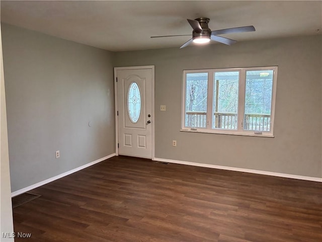 entrance foyer with dark hardwood / wood-style flooring and ceiling fan