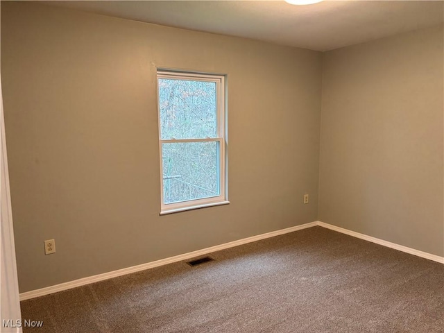 spare room featuring carpet flooring