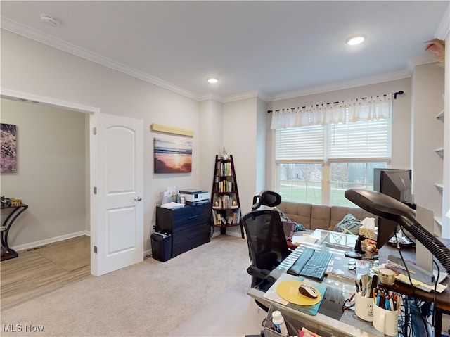 home office with light carpet and ornamental molding