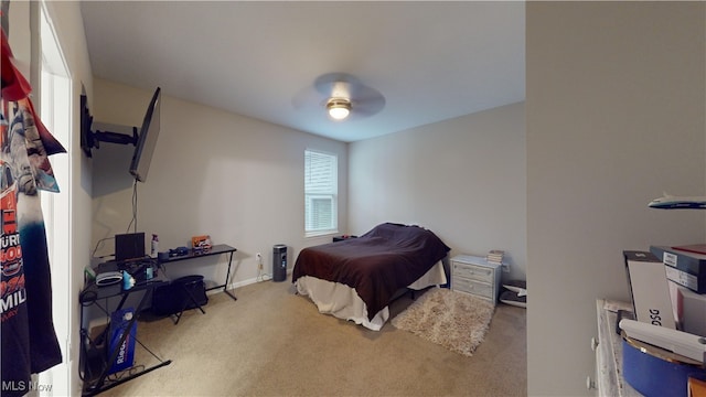 bedroom with ceiling fan and light colored carpet