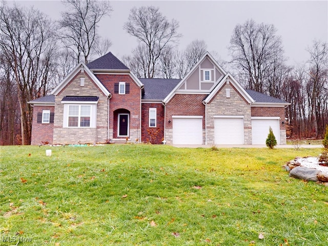 view of front of house with a garage and a front yard