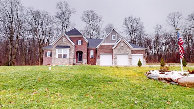 view of front of property with a garage and a front lawn