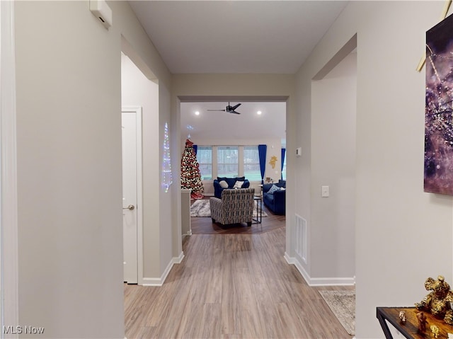 hall with light hardwood / wood-style flooring