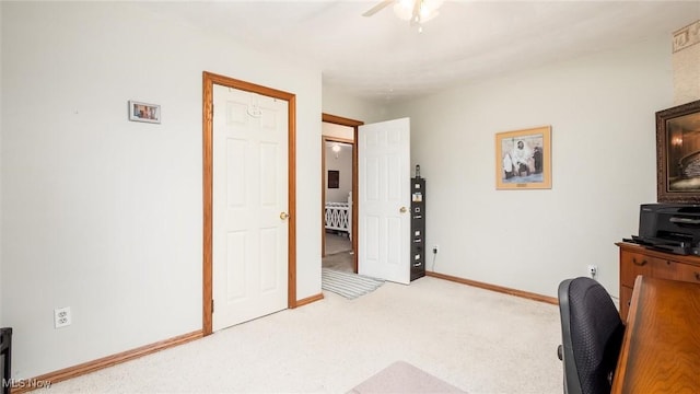 office area with carpet and ceiling fan