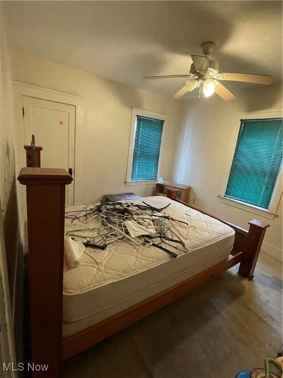 bedroom with wood-type flooring and ceiling fan