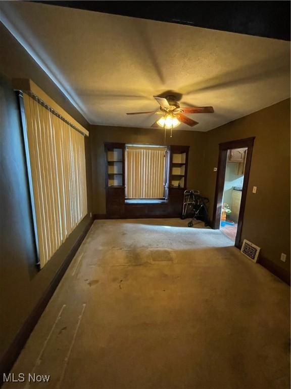 unfurnished room featuring ceiling fan