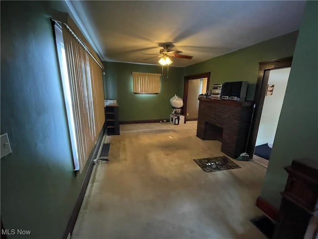 interior space featuring a fireplace and ceiling fan