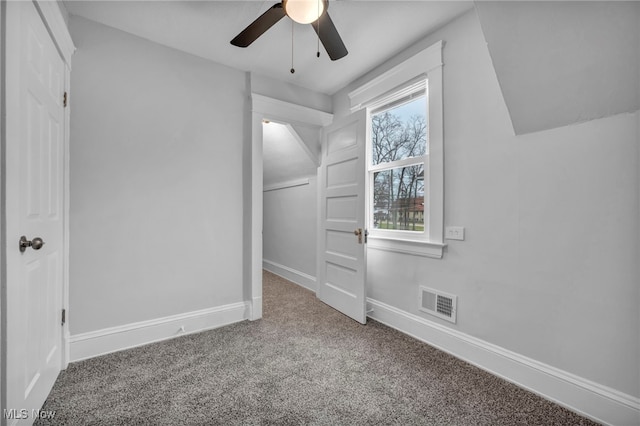 interior space featuring carpet floors and ceiling fan