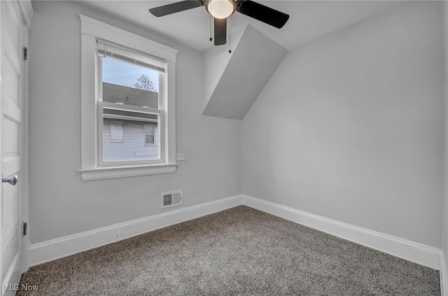 additional living space featuring carpet floors, ceiling fan, and lofted ceiling