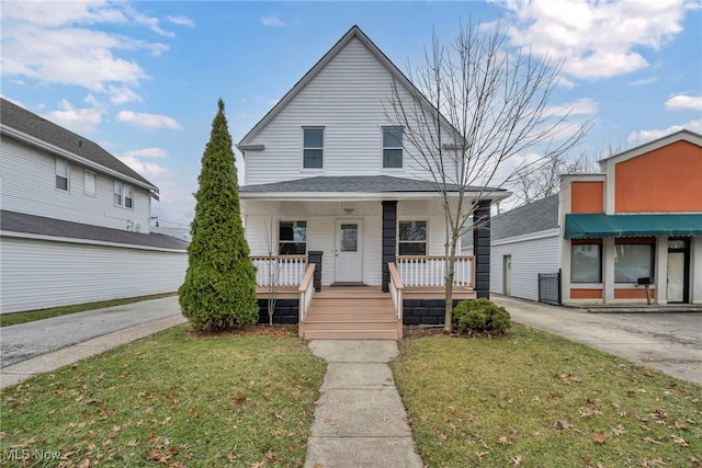 view of front of house featuring a front lawn and a porch