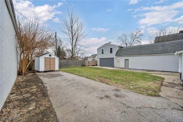 exterior space featuring a storage unit and a front lawn