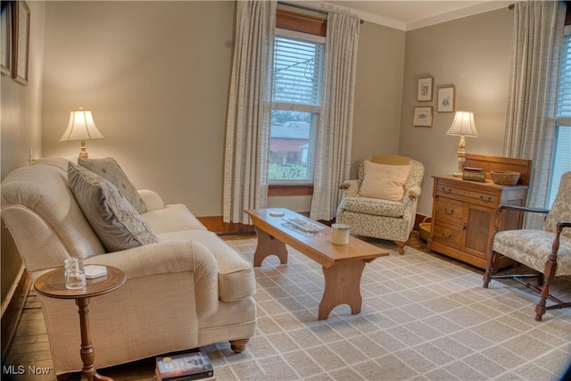 sitting room featuring crown molding