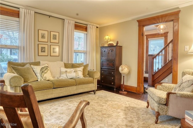 sitting room with hardwood / wood-style flooring and ornamental molding