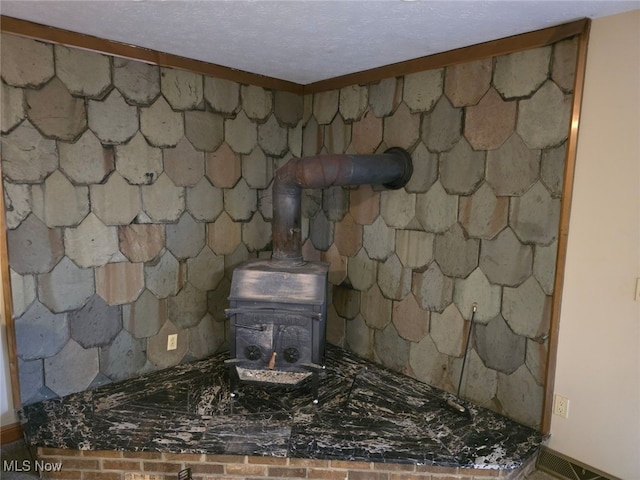 interior details featuring a textured ceiling