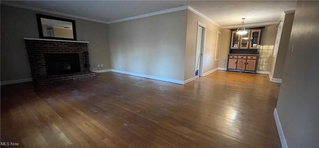 unfurnished living room with a fireplace, dark hardwood / wood-style flooring, and ornamental molding