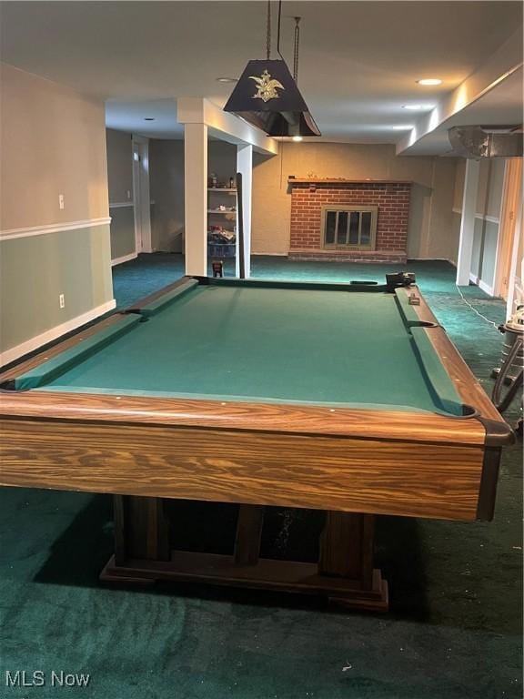 recreation room featuring dark carpet, a fireplace, and billiards