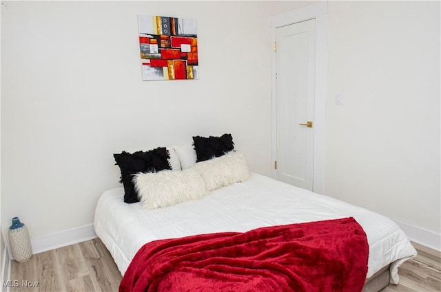 bedroom with wood-type flooring