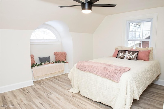 bedroom featuring wood-type flooring, ceiling fan, and lofted ceiling