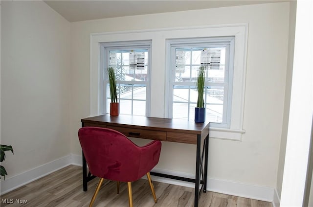 office space with hardwood / wood-style floors