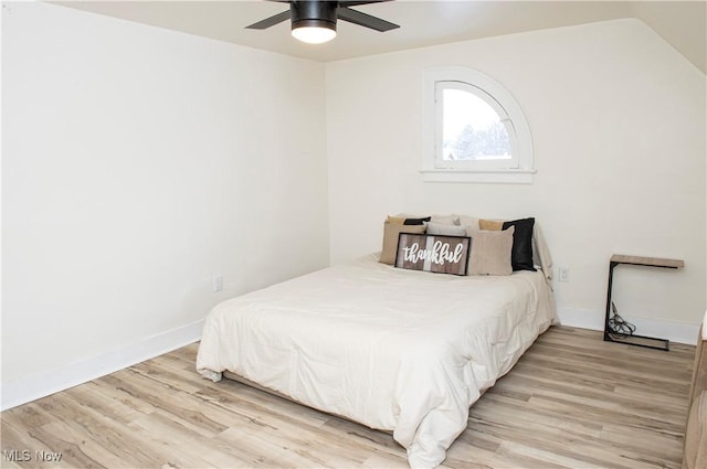 bedroom with ceiling fan and light wood-type flooring