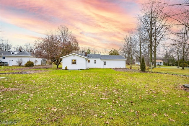 view of yard at dusk