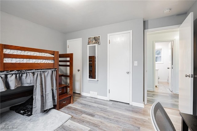 bedroom featuring light hardwood / wood-style floors