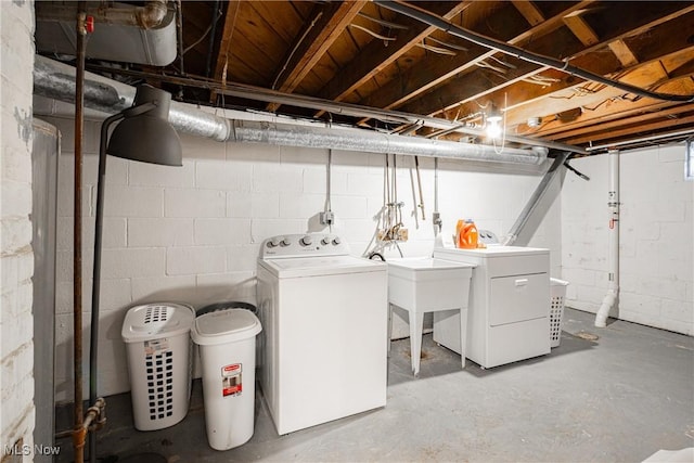 laundry room featuring independent washer and dryer and sink