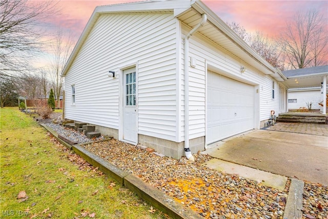 property exterior at dusk with a garage