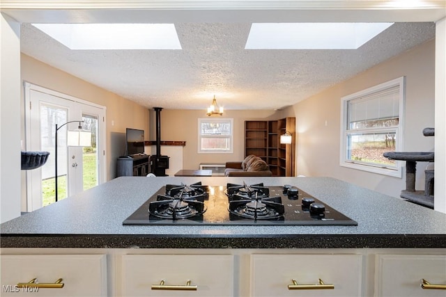 kitchen featuring a healthy amount of sunlight and a skylight