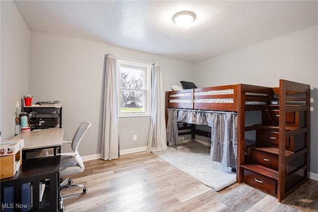 bedroom with light hardwood / wood-style flooring