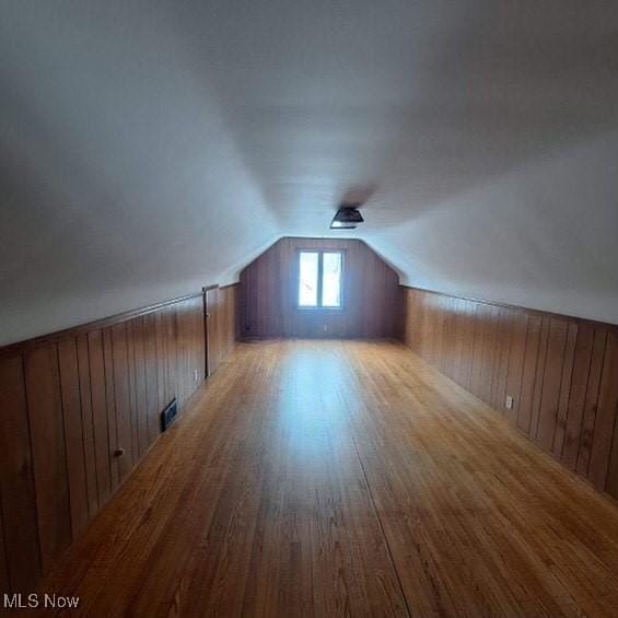 bonus room featuring hardwood / wood-style floors and lofted ceiling