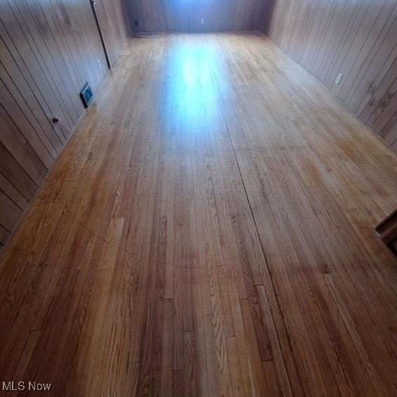 details with wood walls and wood-type flooring